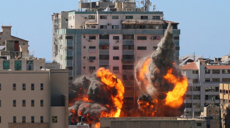 A tower housing AP, Al Jazeera offices collapses after Israeli missile strikes in Gaza city