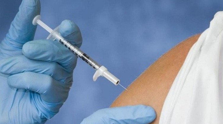 A medical worker receives the second dose of the Pfizer-BioNTech coronavirus disease (COVID-19) vaccine at a vaccination centre in Seoul, South Korea