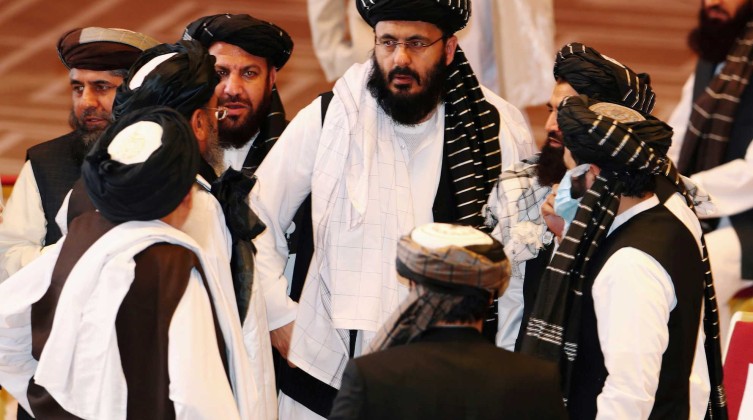 FILE PHOTO: Taliban delegates speak during talks between the Afghan government and Taliban insurgents in Doha, Qatar September 12, 2020