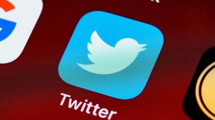 Twitter app is seen on a smartphone in this illustration