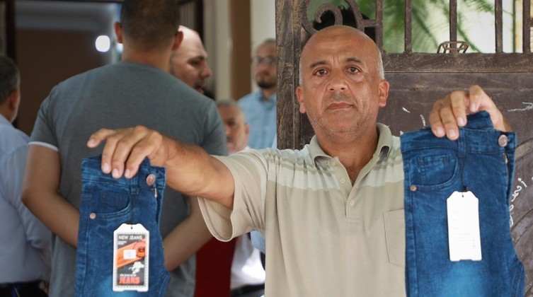 الاقتصاد بغزة: الاتفاق على إيقاف فرض رسوم على الكوتة الجديدة للجينز المستورد